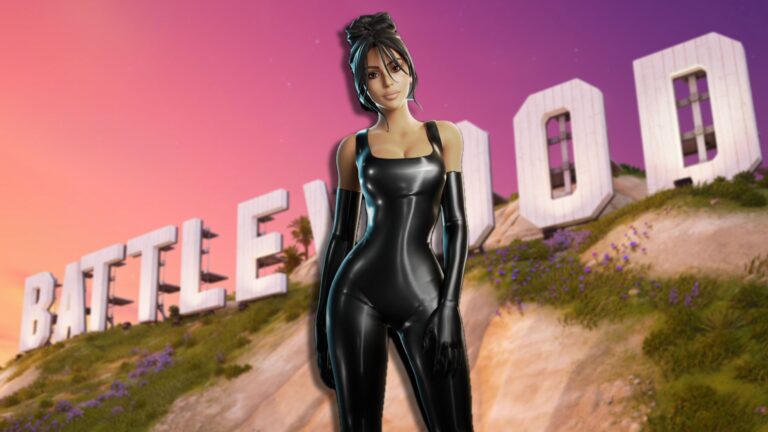 Kim Kardashian standing in front of the 'Battlewood' sign as the sun sets behind her