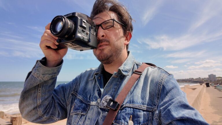 Image of a man holding a camera