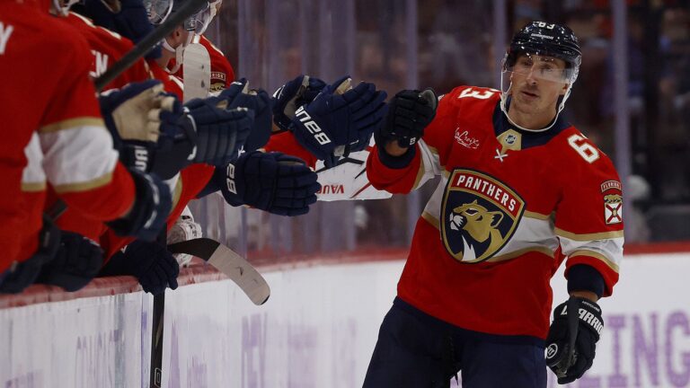 Brad Marchand of the Florida Panthers celebrates a goal with teammates during an NHL ice hockey match.