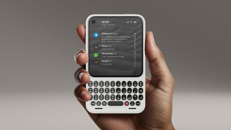 A hand holds a retro-looking Clicks Communicator phone